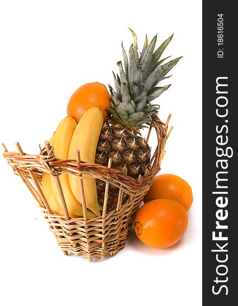 Basket with fruits on white background