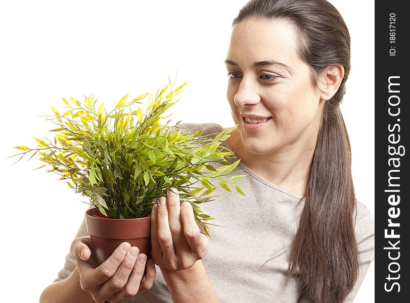 Beautiful Woman Holding A Small Plant