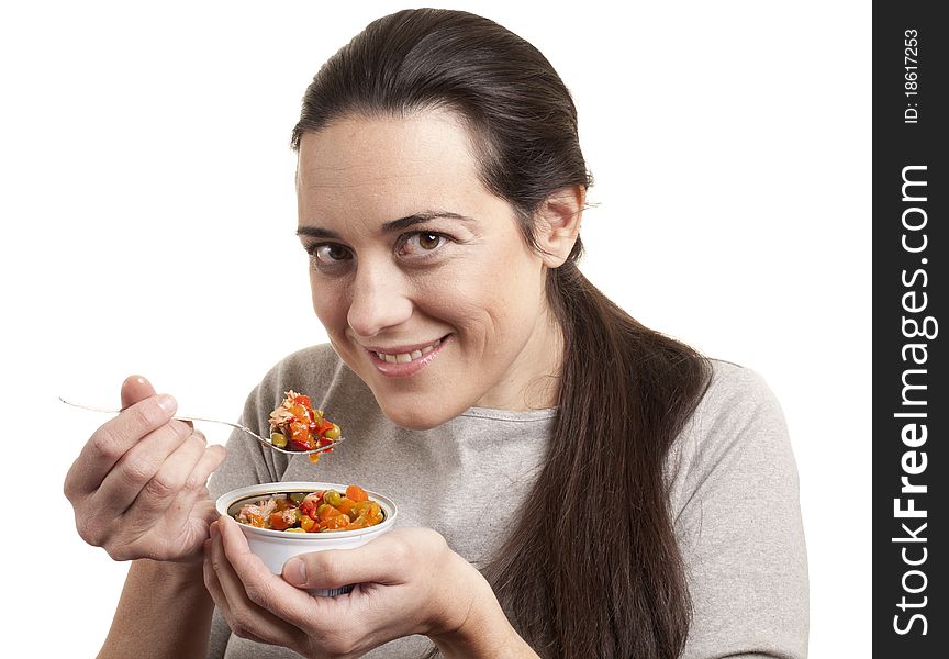 Portrait of young happy woman eating salad