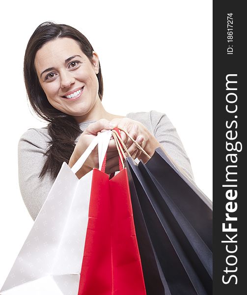 Beautiful woman with shopping bags on white background