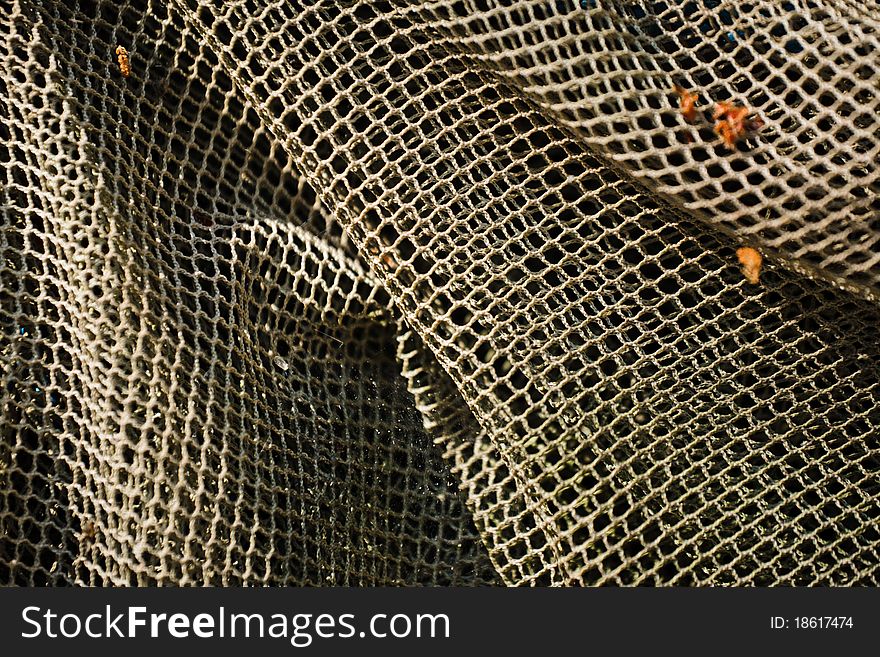 Old and decrepit fish net close up. Old and decrepit fish net close up