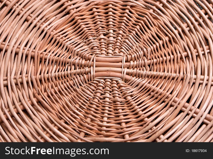 Round wicker texture background of light brown colour