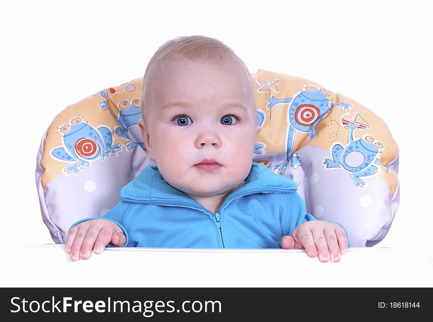 in a baby chair on a white background. in a baby chair on a white background