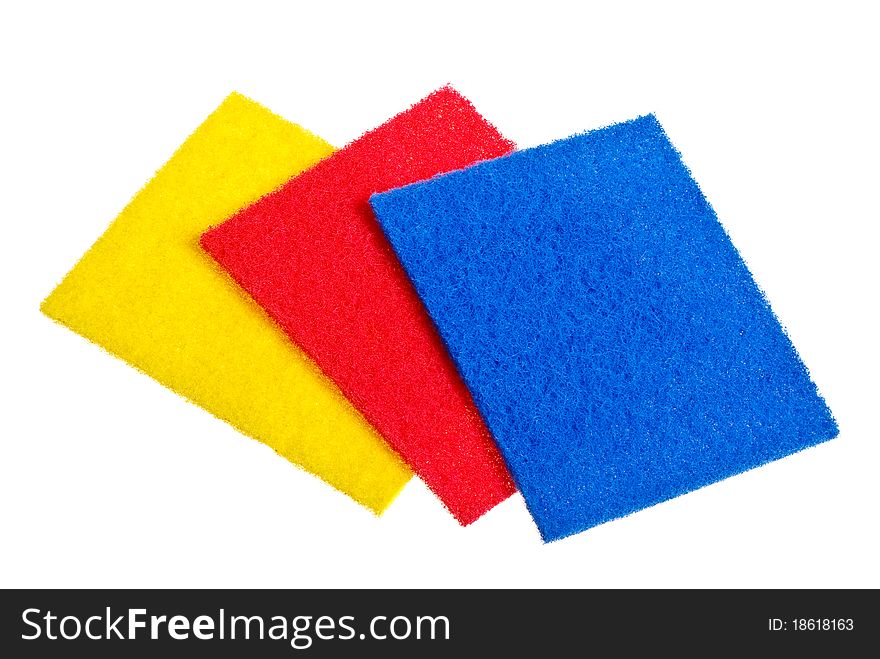 Multicolored sponges for dishwashing isolated on a white background.