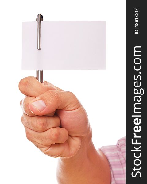 Hand holding a pen and a white card over white background