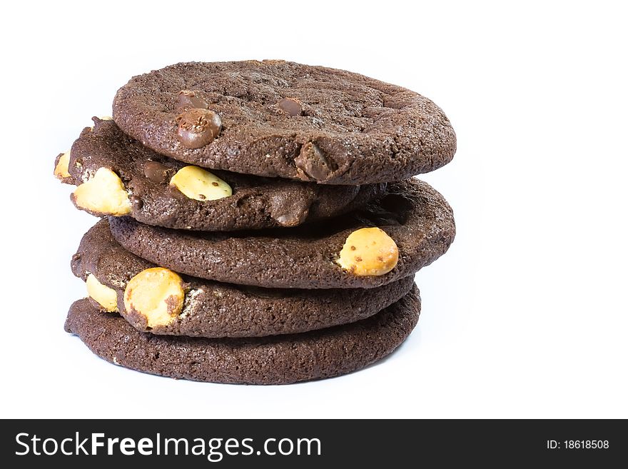 A stack of chocolate cookies with dark and white chocolate chips. A stack of chocolate cookies with dark and white chocolate chips.
