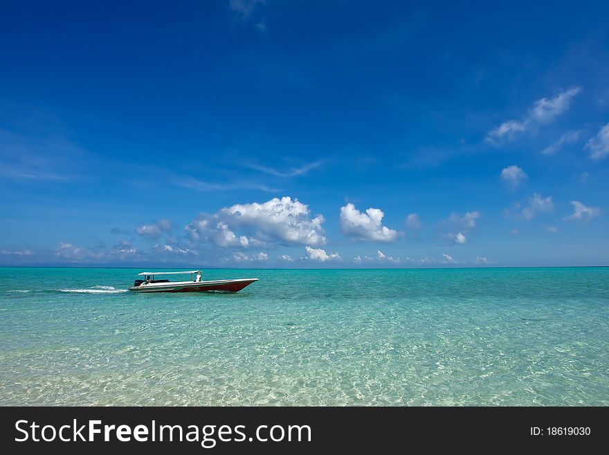 Small Boat At Beautiful Ocean