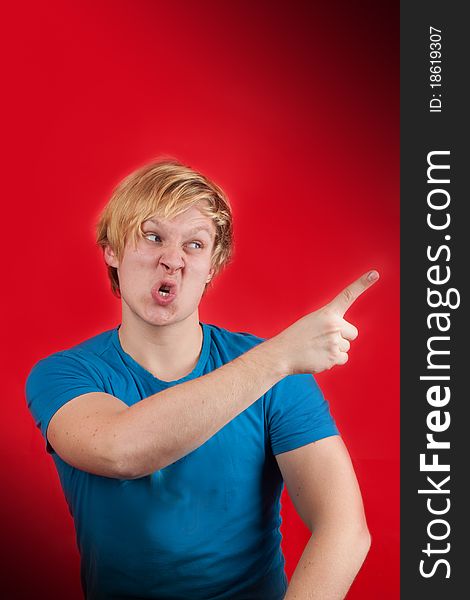 Man looking agressive and ready to fight on red background. Man looking agressive and ready to fight on red background
