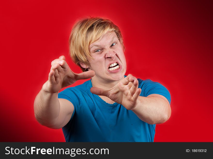 Man reaching to hurt someone unlucky on red background. Man reaching to hurt someone unlucky on red background