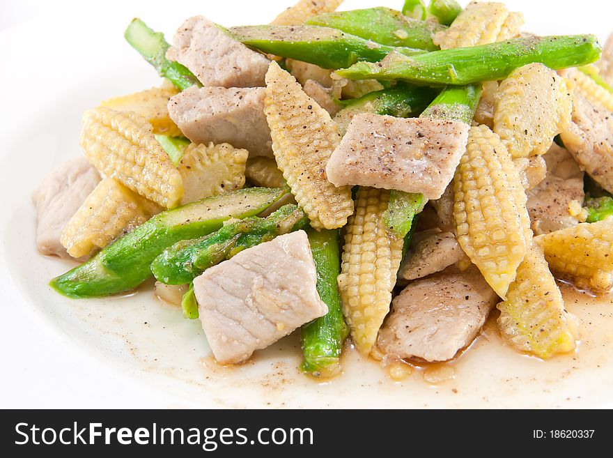 Asparagus ,young corn and pork fry with spice and oyster sauce. Asparagus ,young corn and pork fry with spice and oyster sauce