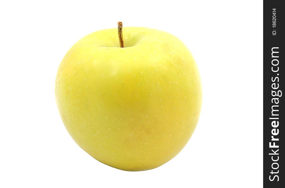 Greenish-yellow apple on the isolated white background