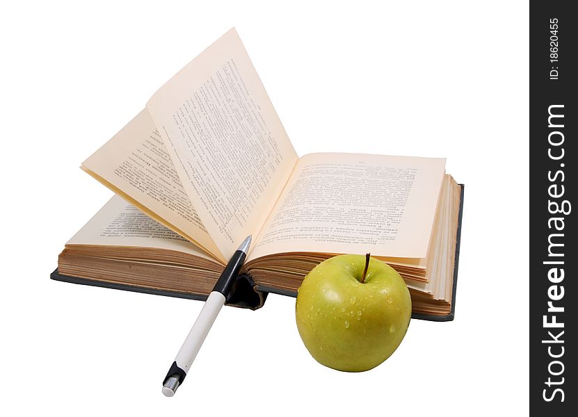 The old open book with a pen and a wet apple on the white isolated background. The old open book with a pen and a wet apple on the white isolated background