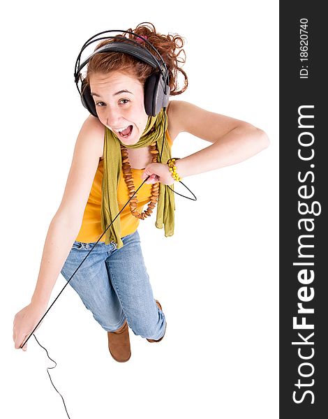 Beautiful teen girl listening music and danceing