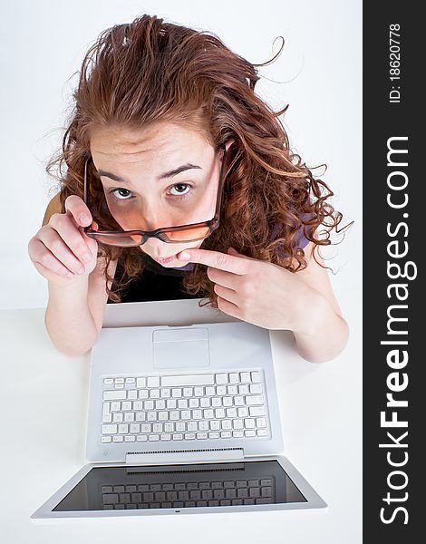 Beautiful teen girl alone with white laptop computer