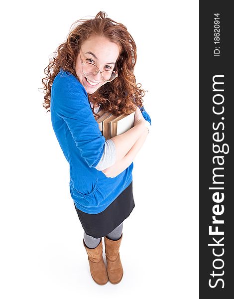 Beautiful teen girl with books on white background