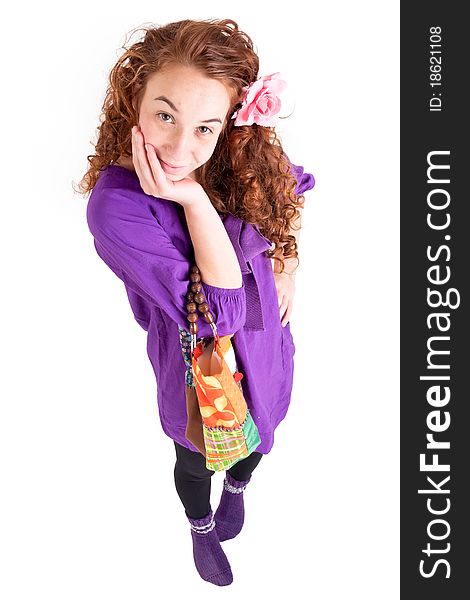 Beautiful teen girl with a little bag on white background