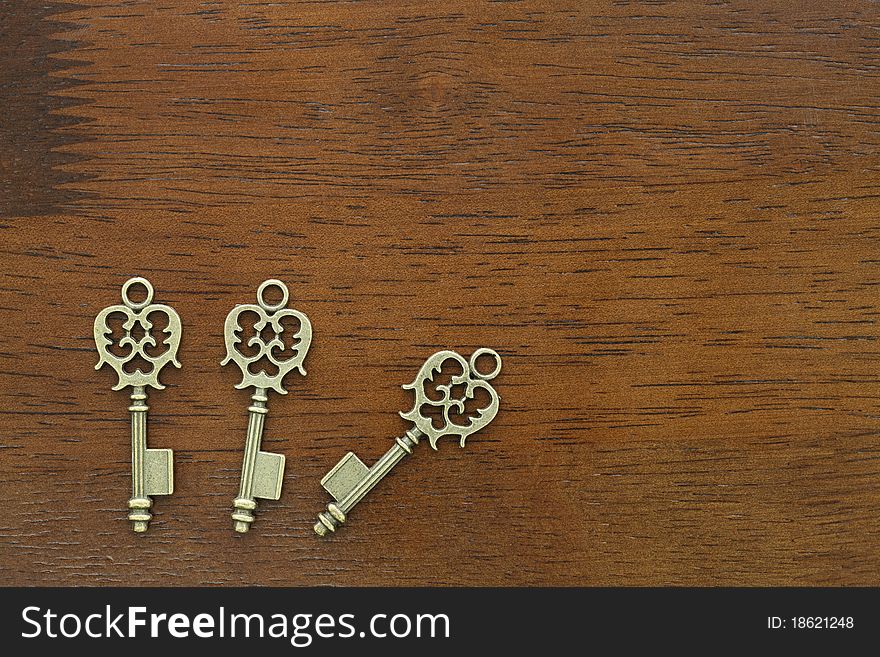 Old key on a wooden table