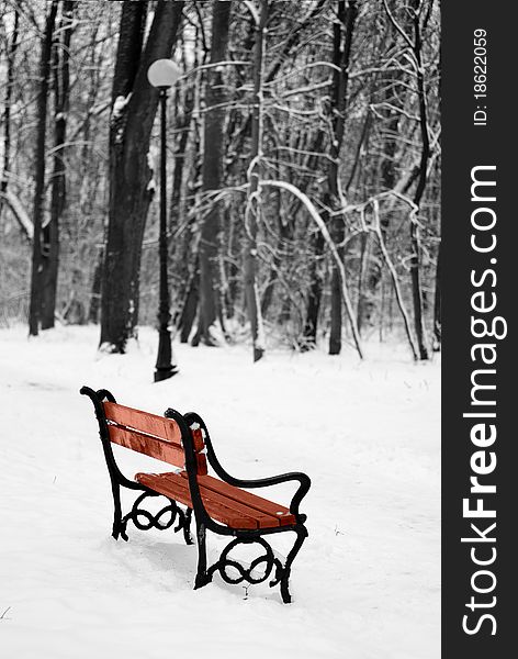 Benches in the winter park filled in with the snow