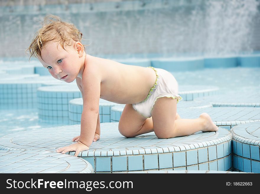 Child in outdoor pool