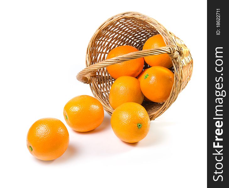 Oranges spilling out of a basket.