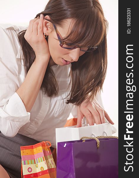 Happy woman with shopping bags over white background