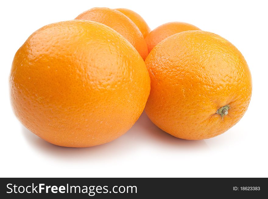 Five fresh orange on a white background