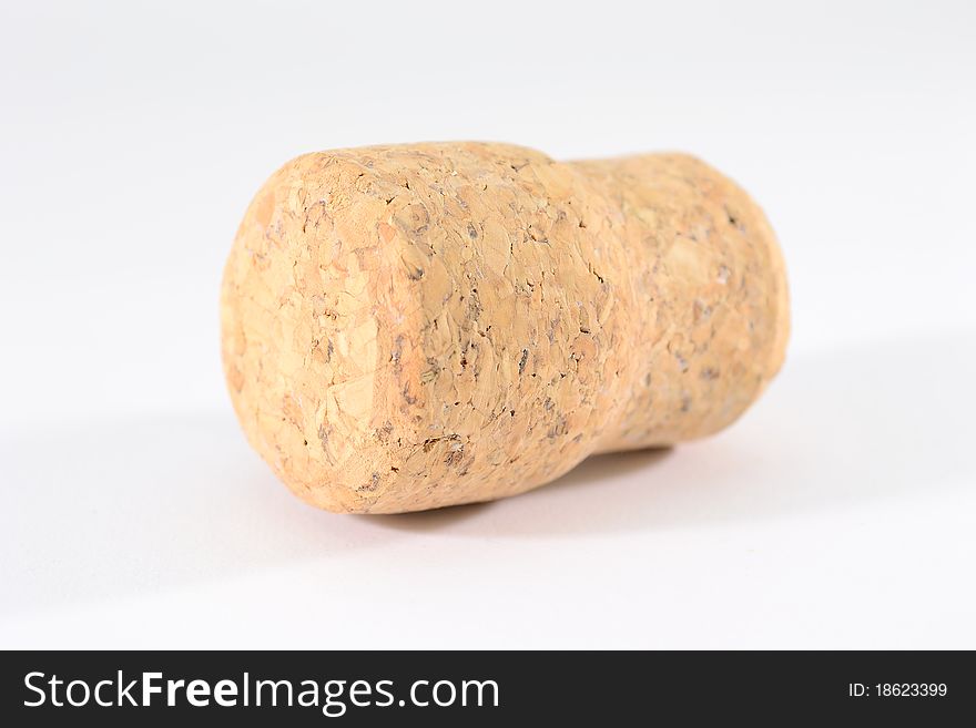 Single champagne cork isolated on white background.