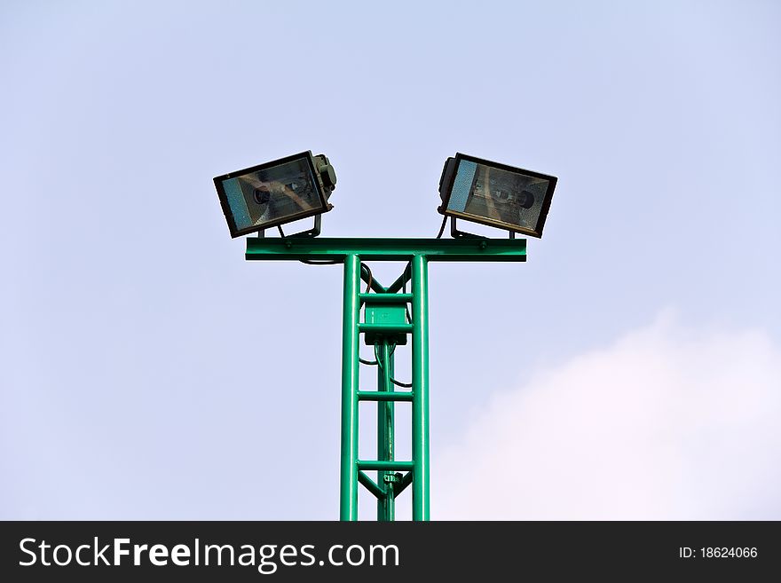 Spot light pole at stadium over sky background. Spot light pole at stadium over sky background.