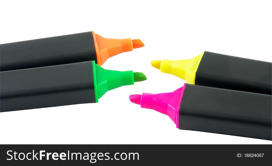 Four colorful markers isolated over white surface