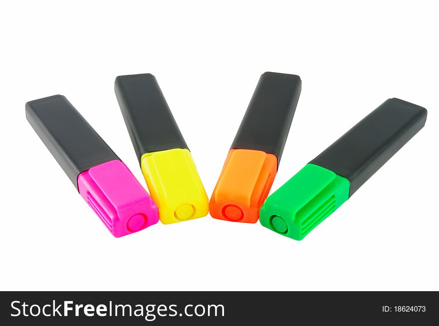 Four colorful markers isolated over white surface