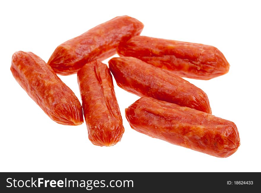 Small spicy salami snacks isolated on a white background