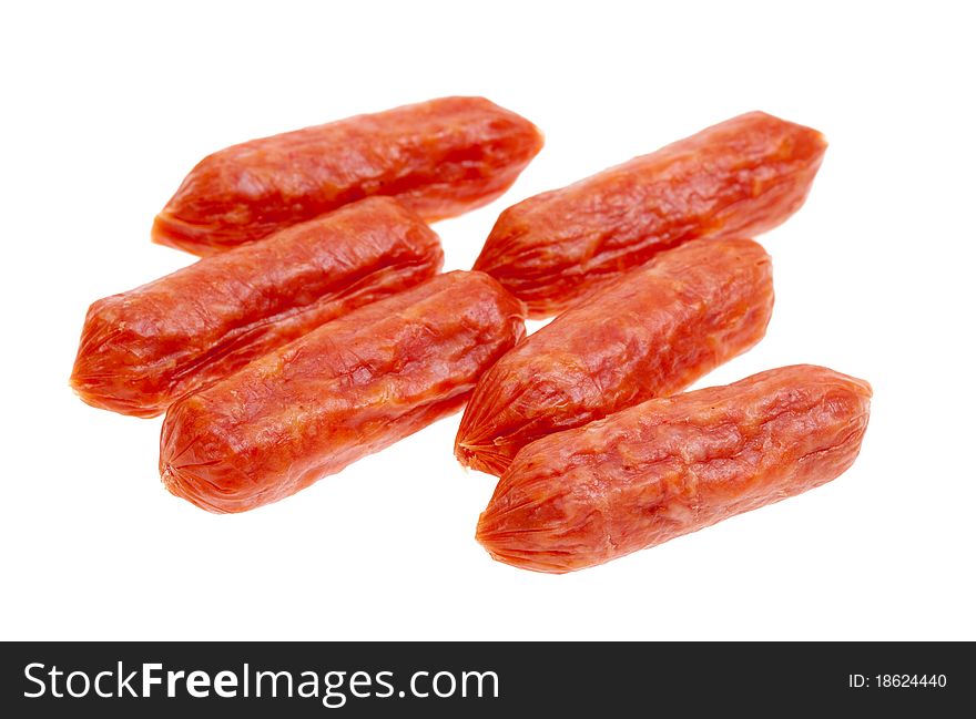 Small spicy salami snacks isolated on a white background