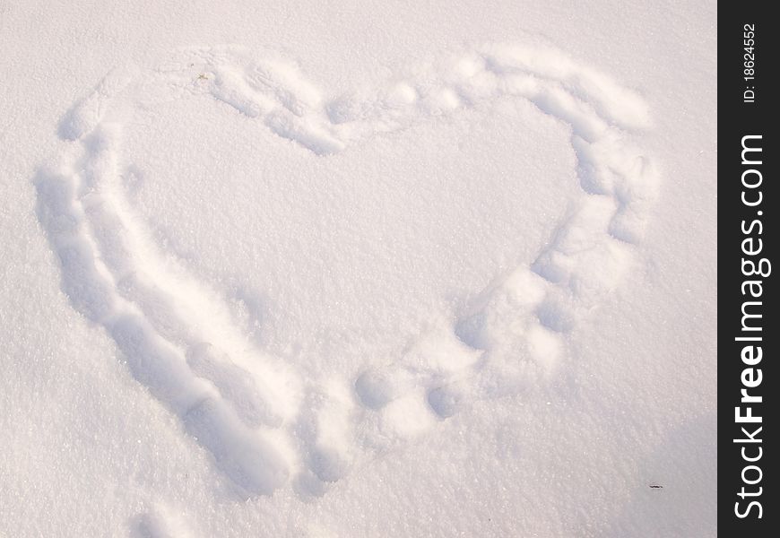 White heart in snow landscape