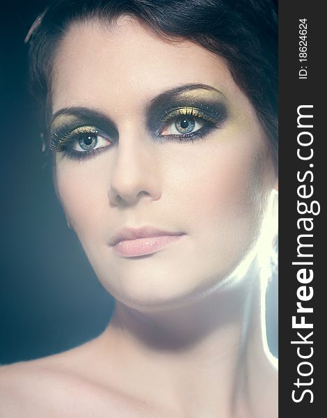 Closeup portrait of a young brunette woman with bright makeup and gorgeous eyes. Closeup portrait of a young brunette woman with bright makeup and gorgeous eyes
