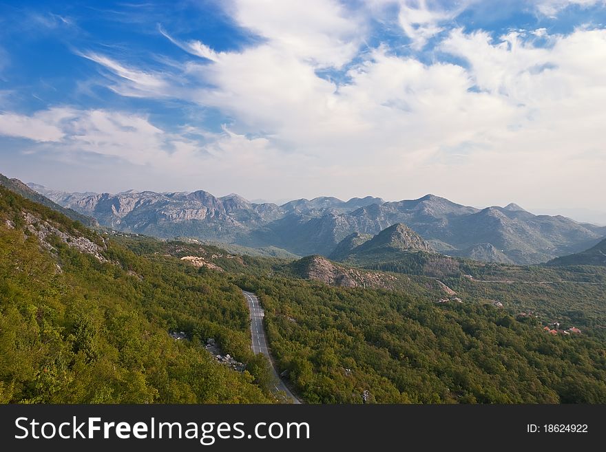 Mountain Landscape with a Road through the Woods. Mountain Landscape with a Road through the Woods