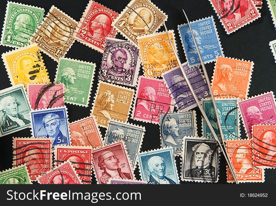 Postage stamps on black background