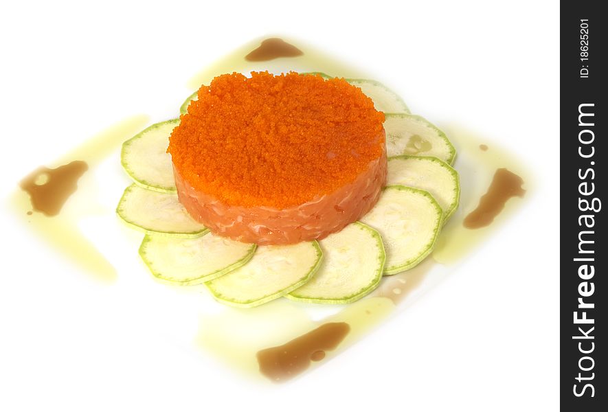 Studio photography of a salmon dish with zucchini and caviar isolated on white