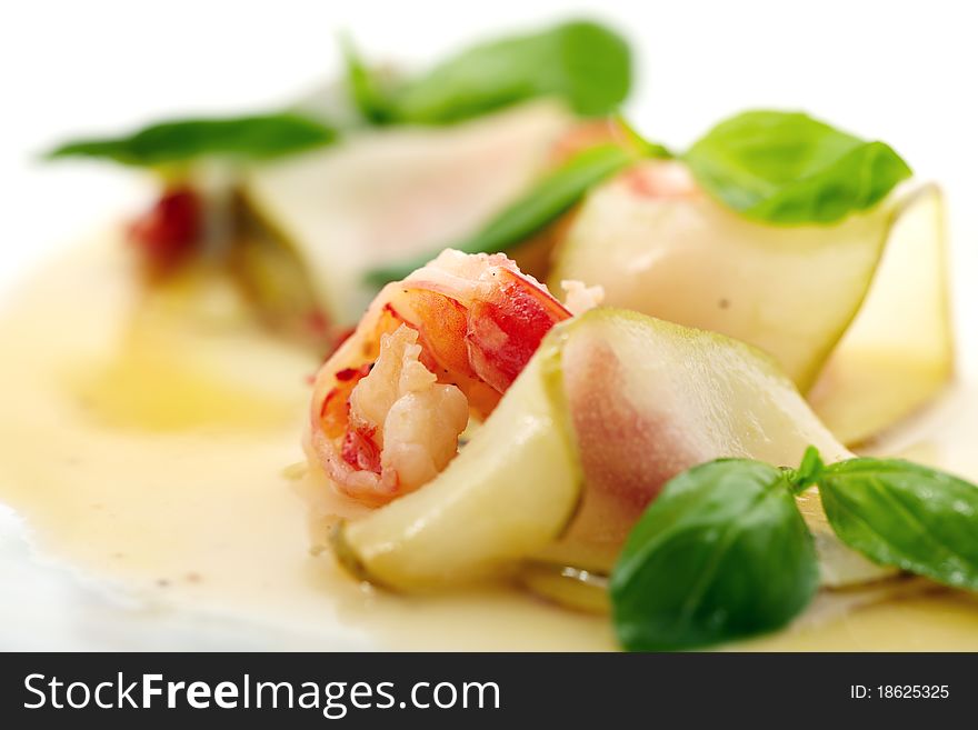 Studio close-up photography of a fried shrimp in a pear tree and decorated with sweet sauce mint leaves