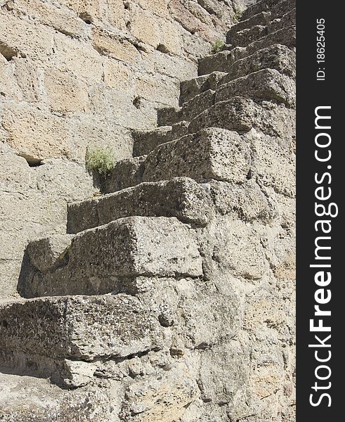 Stone ladder on an old medieval wall. Stone ladder on an old medieval wall