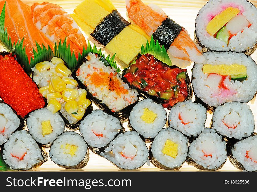 An Assortment Of Japanese Sushi. They Are Rice Pastries Topped With Seafoods Or Vegetables