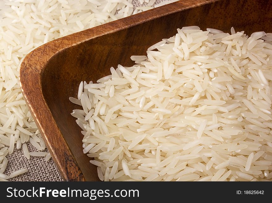 Close-up of white rice in a brown plate.