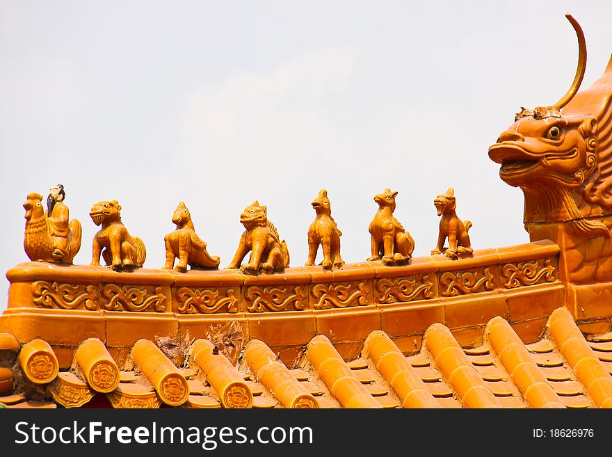 Many imaginary animals are at roof of Chinese temple. Many imaginary animals are at roof of Chinese temple.