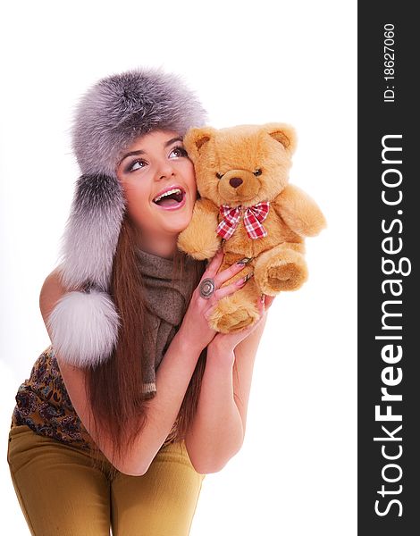 Beautiful longhair girl is holding the teddy bear. Beautiful longhair girl is holding the teddy bear