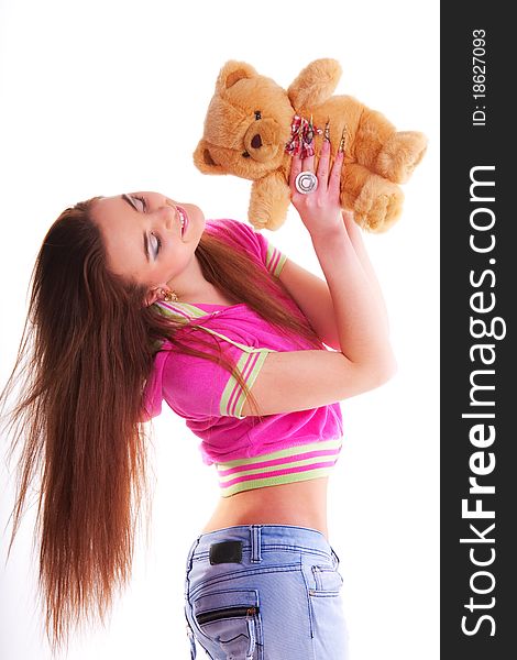 Beautiful longhair girl is holding the teddy bear. Beautiful longhair girl is holding the teddy bear