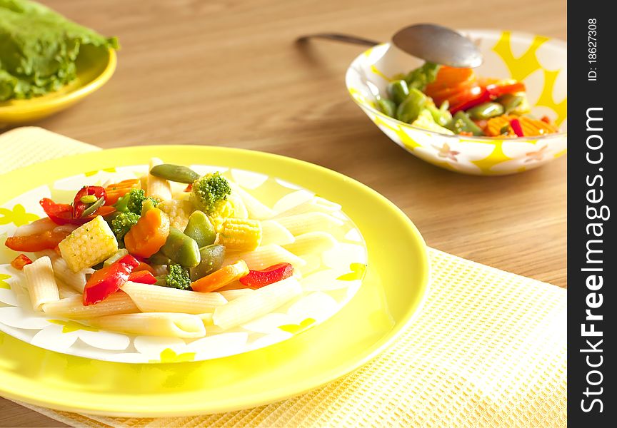 Vegetables with pasta in a brigth plate