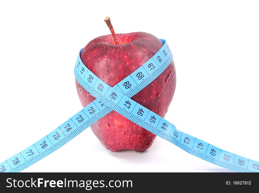 Red apples bind with a tape measure. Red apples bind with a tape measure.
