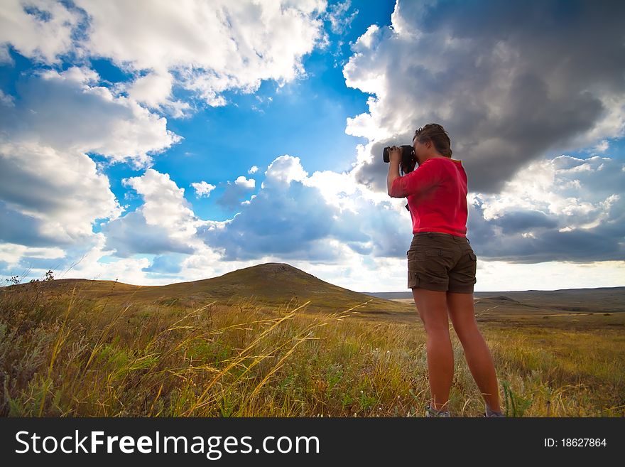 Girl taking picture on natural background. Girl taking picture on natural background