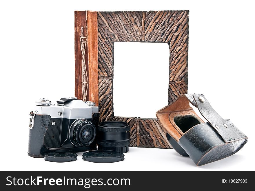Vintage camera and photo album with empty picture. Isolated on white. Focus on camera. Vintage camera and photo album with empty picture. Isolated on white. Focus on camera