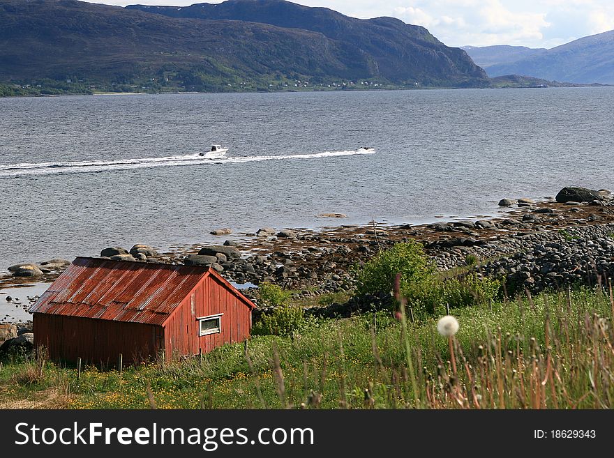 Red Hut At A Coast In Norway