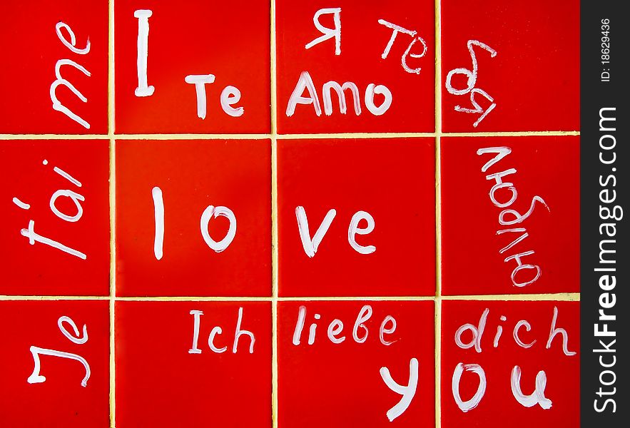 Inscriptions I love you in different languages on the red tiles